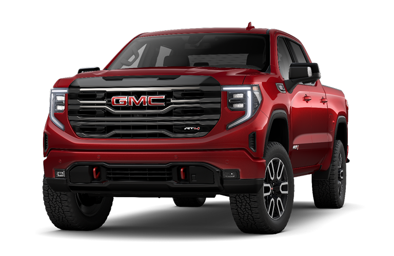 Red GMC pickup truck shown from a front three-quarter angle